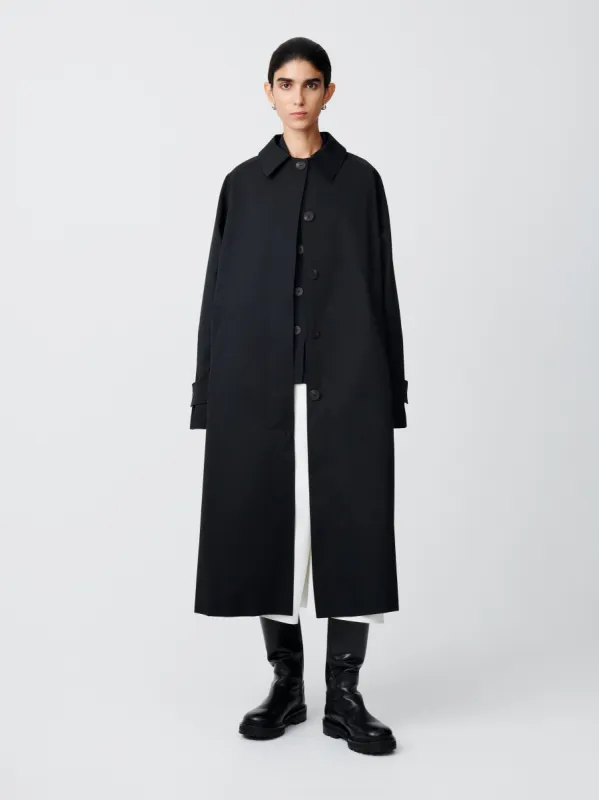 Holin Coated Cotton Coat in Black sold by Studio Nicholson
