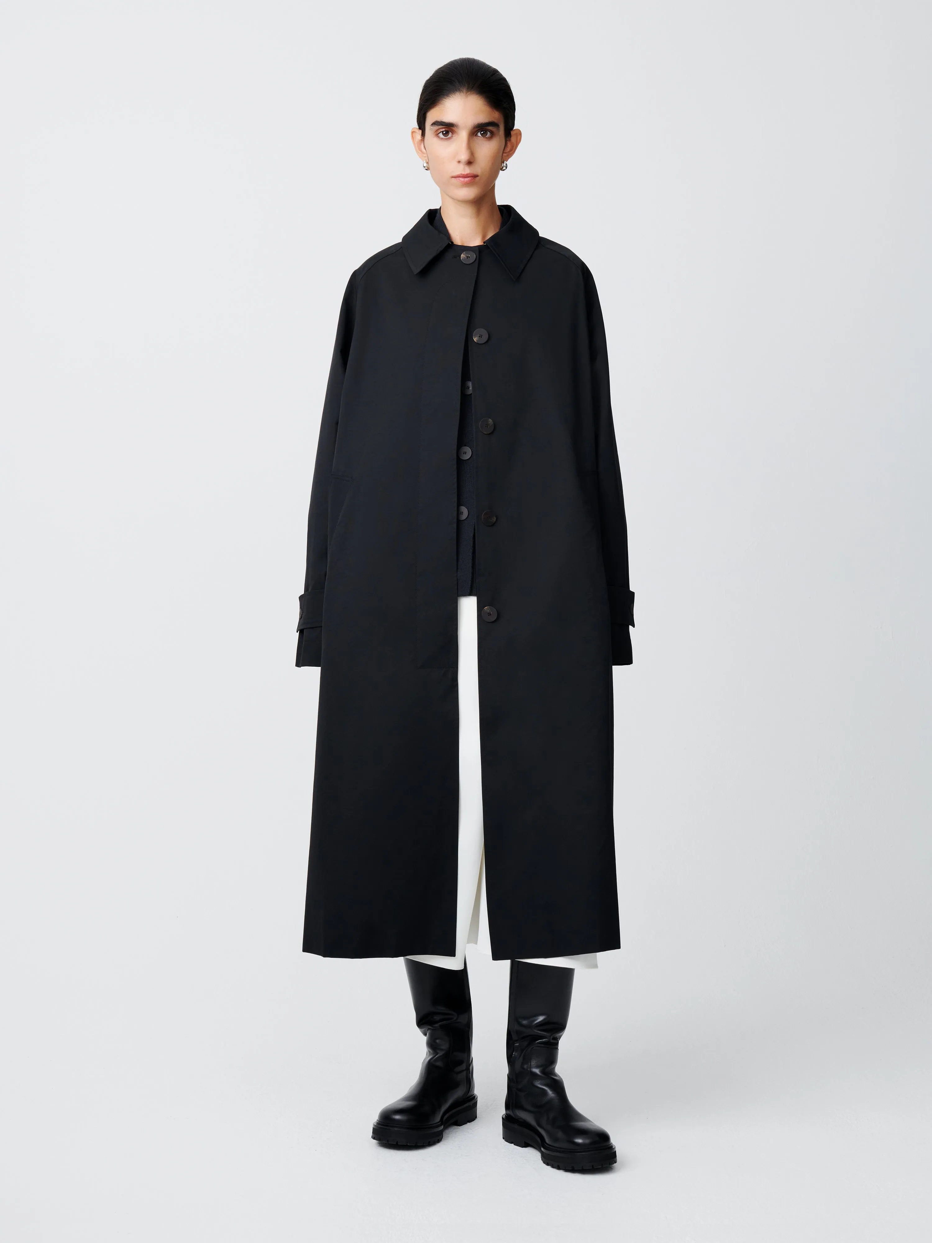 Holin Coated Cotton Coat in Black sold by Studio Nicholson