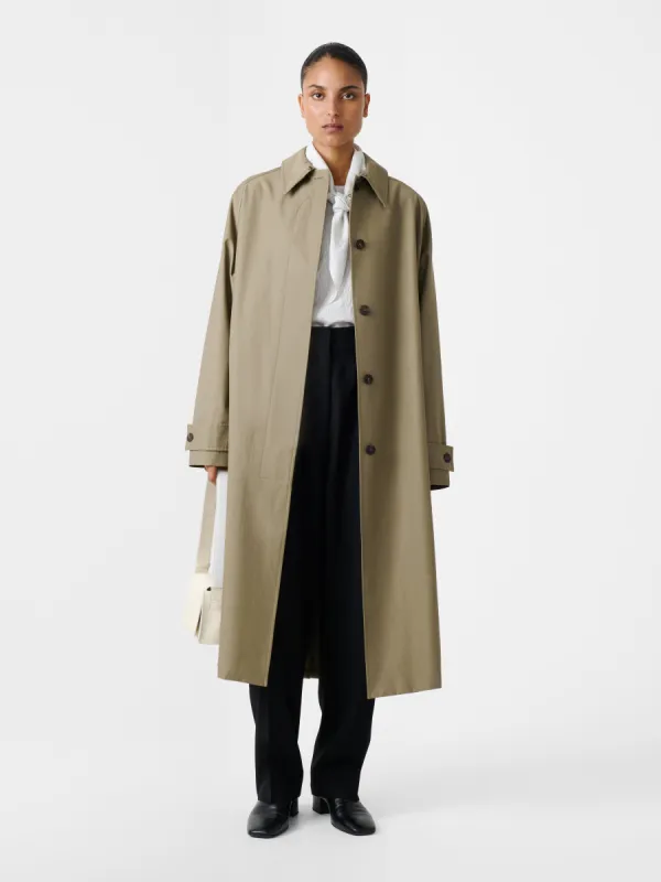 Holin Coated Cotton Coat in Dark Dusk sold by Studio Nicholson