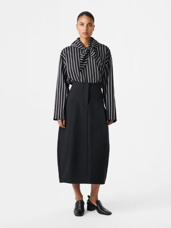 Carson Skirt in Black sold by Studio Nicholson