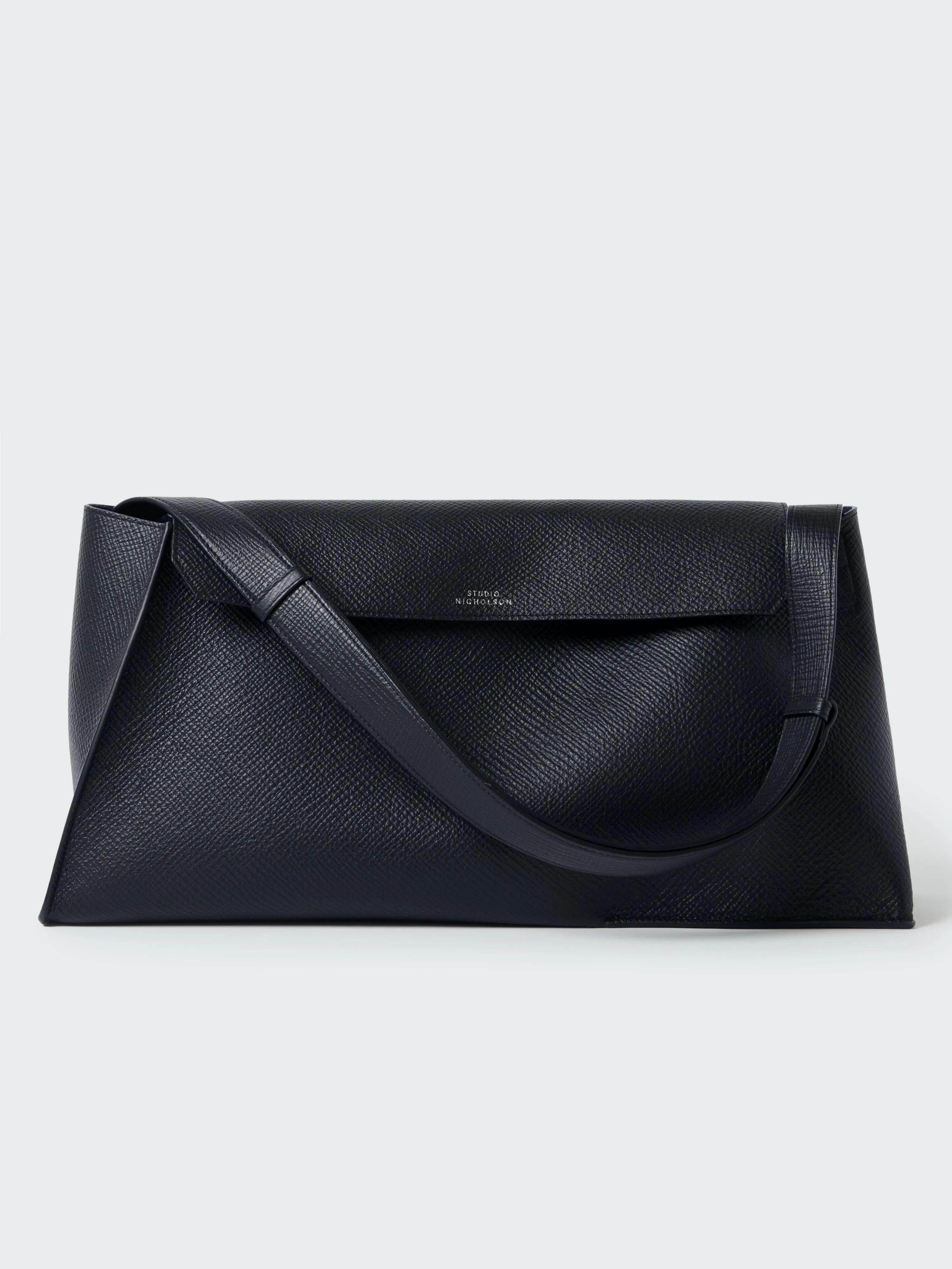 Shiboru Leather Bag in Darkest Navy sold by Studio Nicholson