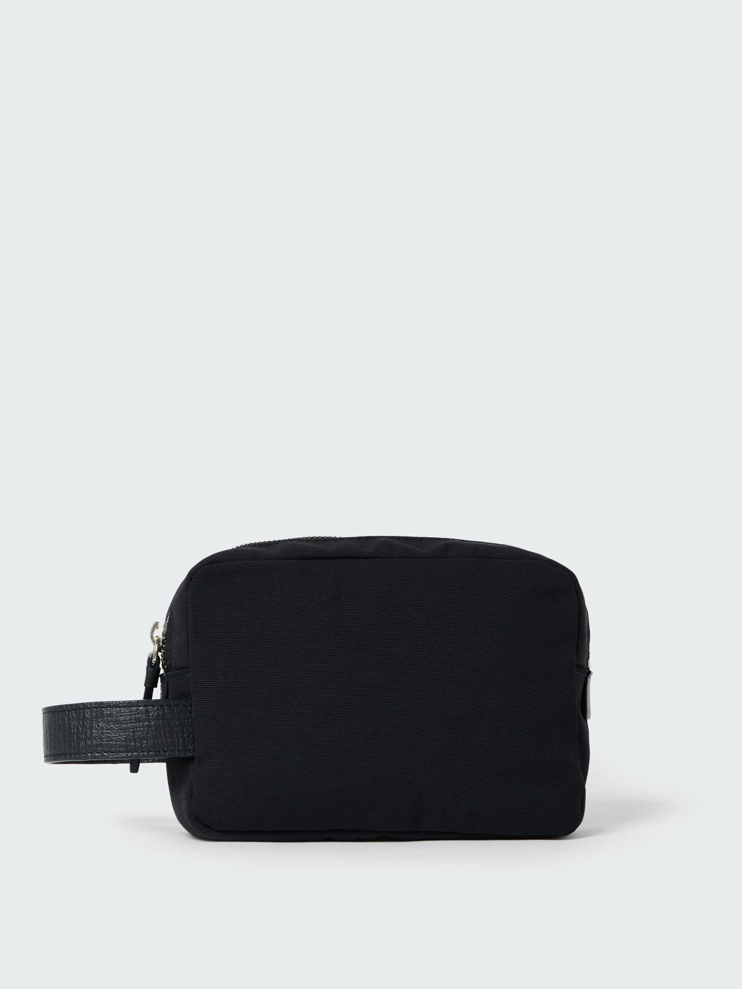 Transit Pouch in Darkest Navy sold by Studio Nicholson