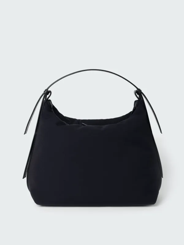 Transit Bag in Darkest Navy sold by Studio Nicholson
