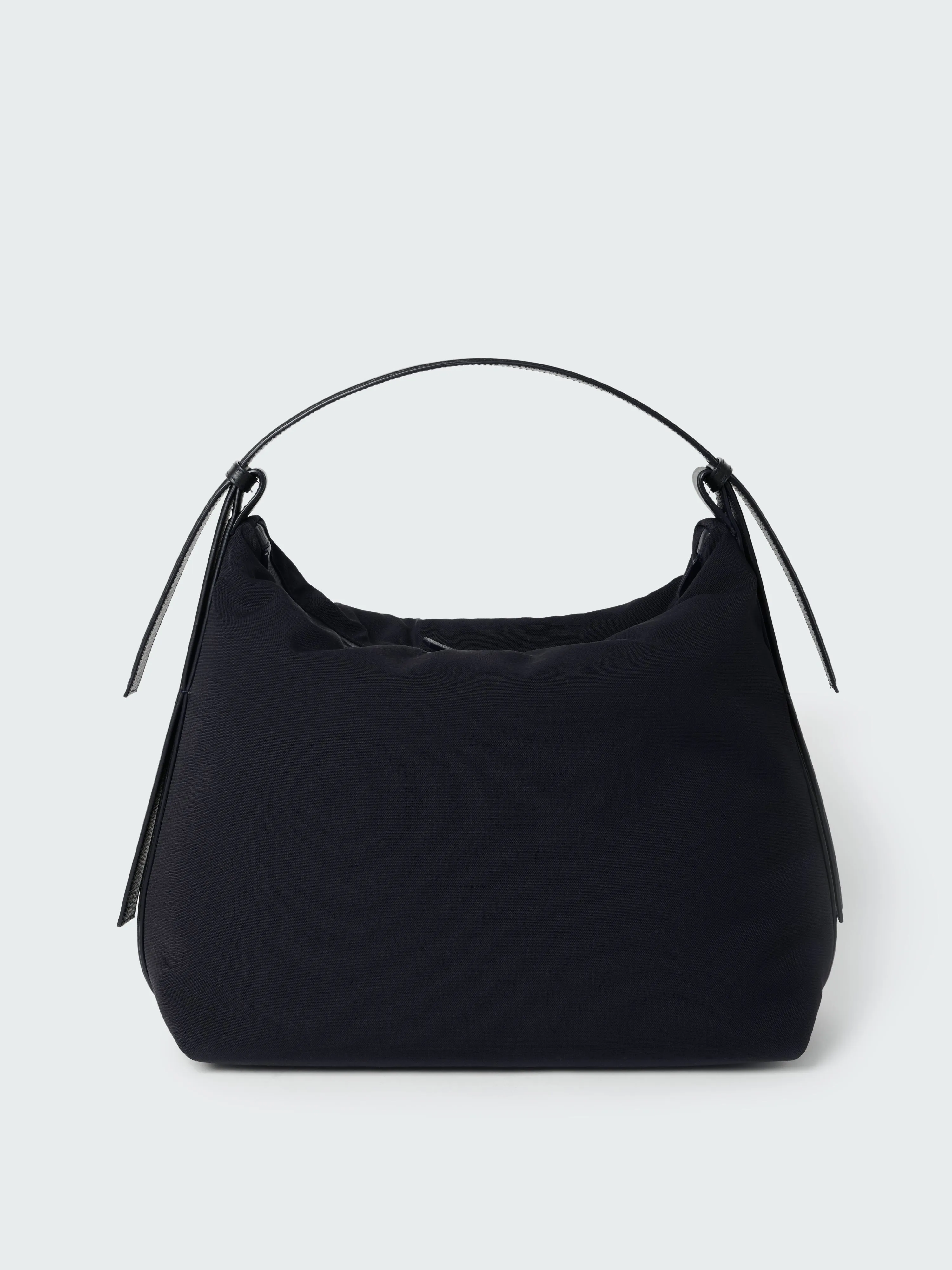 Transit Bag in Darkest Navy sold by Studio Nicholson