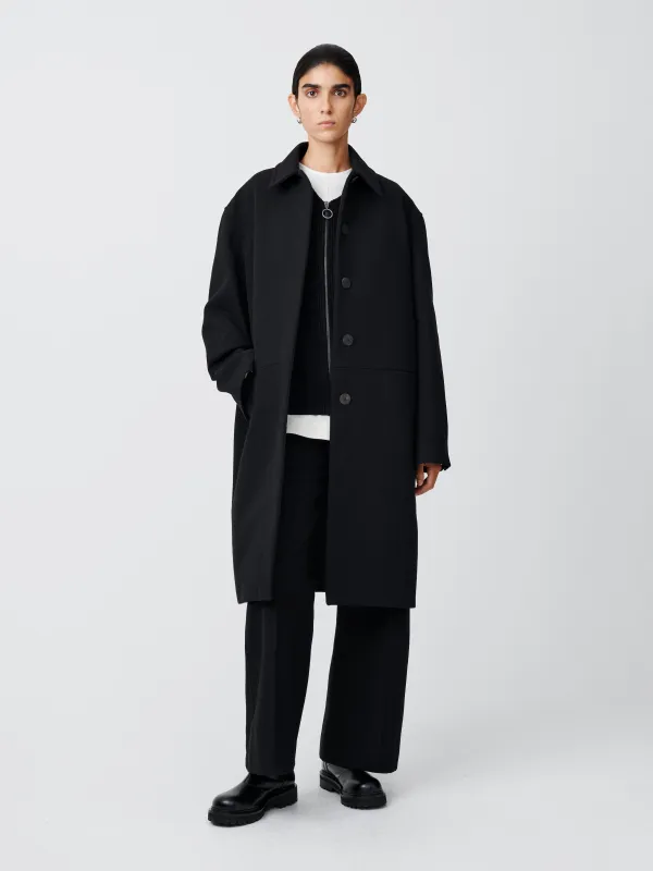 Ness Coat in Black sold by Studio Nicholson