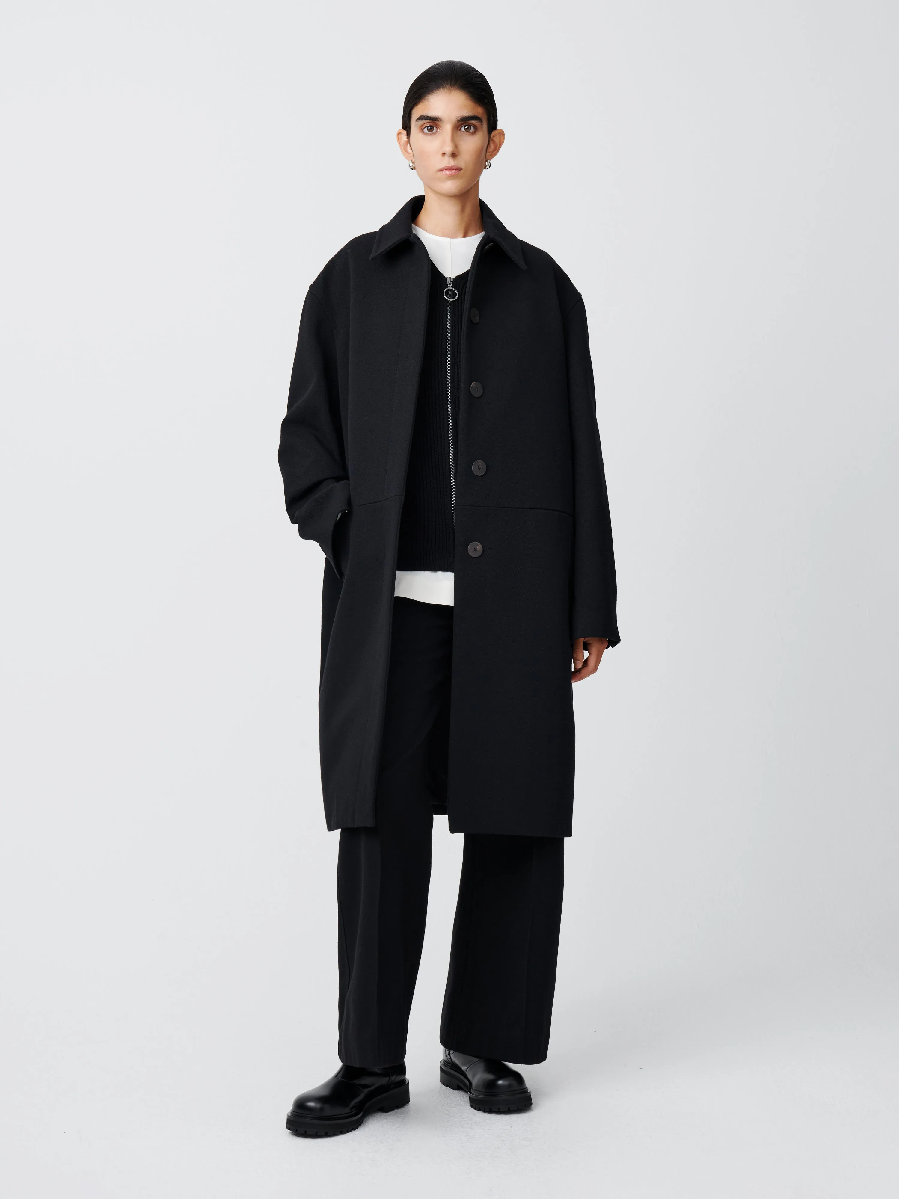Ness Coat in Black sold by Studio Nicholson