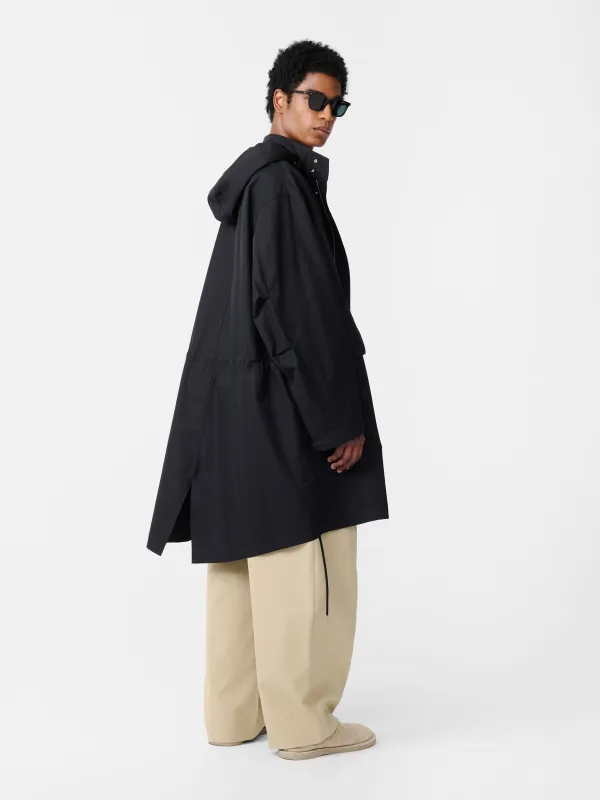 Mobi Coat in Oil sold by Studio Nicholson