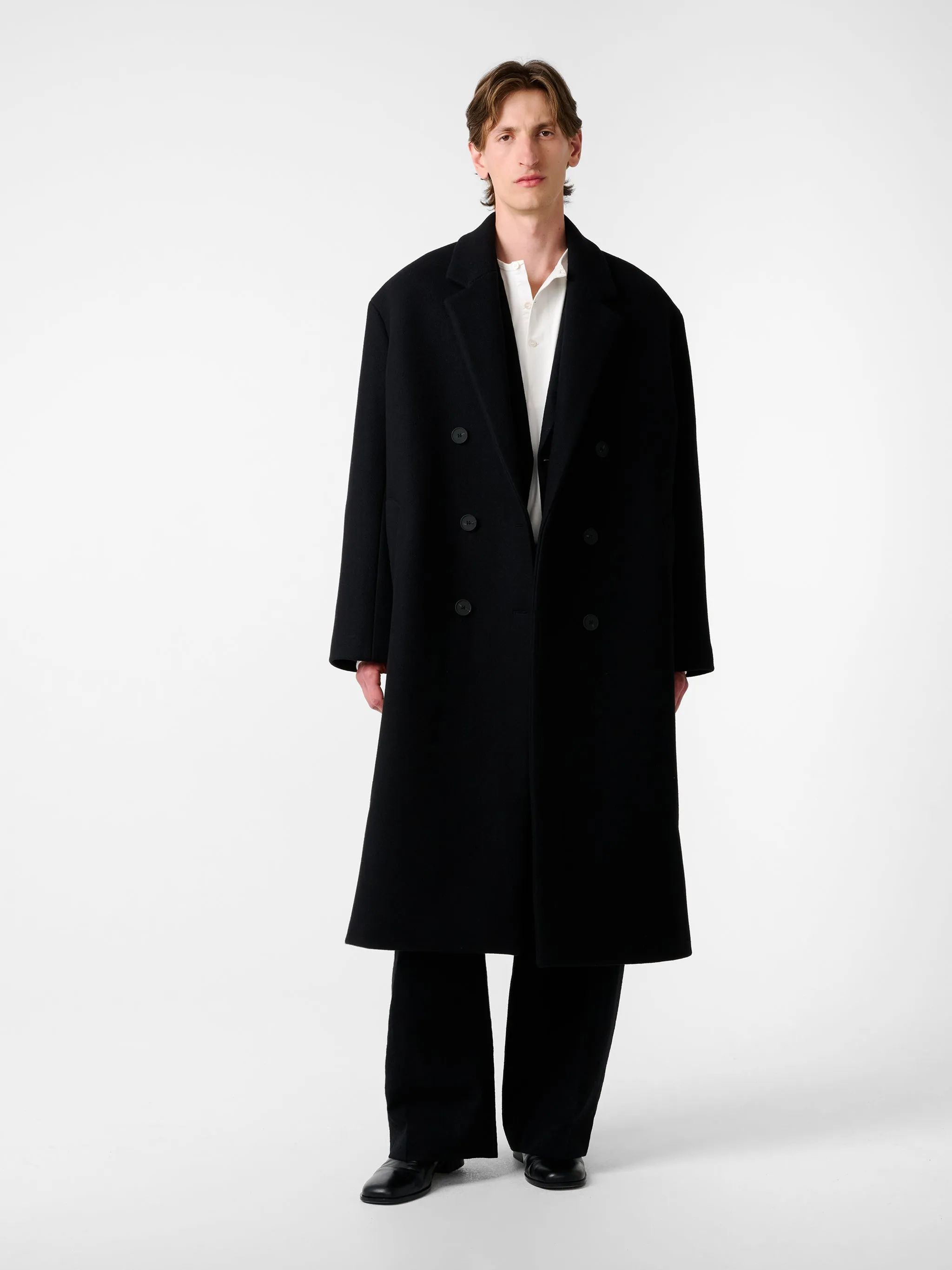 Diall Coat in Black sold by Studio Nicholson