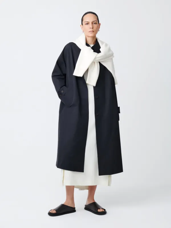 Holin Coat in Black sold by Studio Nicholson