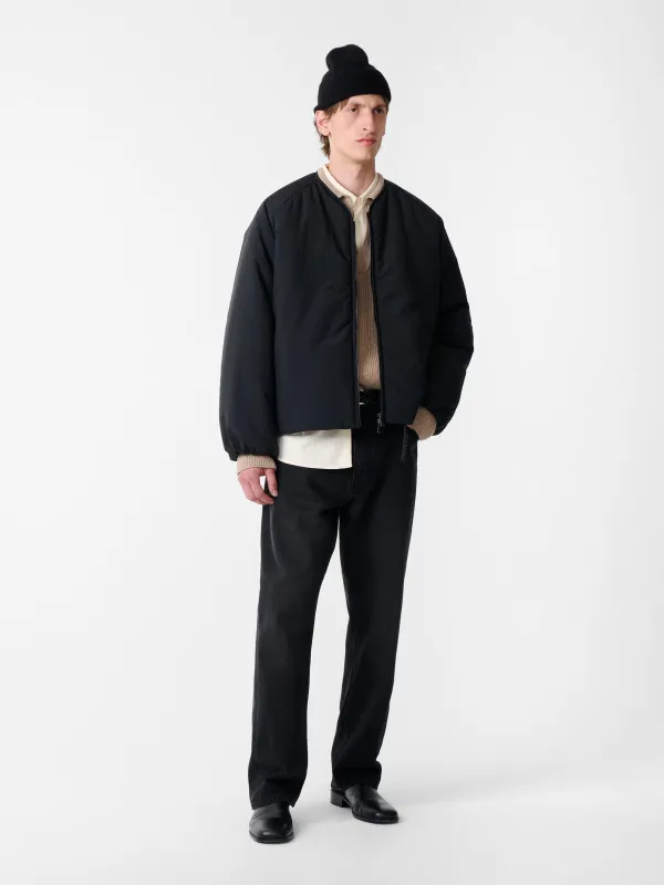 Nicio Puffer Jacket in Darkest Navy made by Studio Nicholson