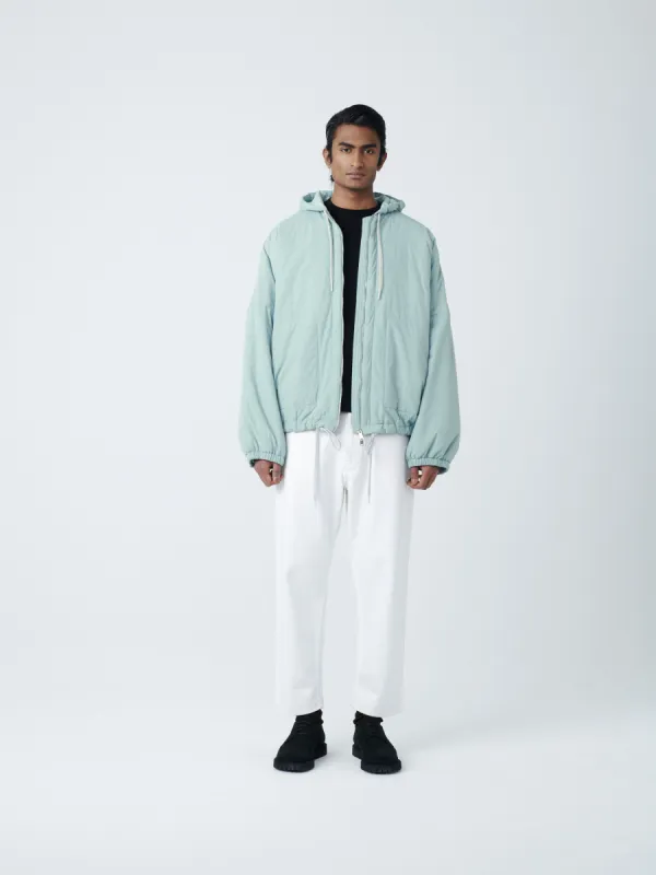 Indus Padded Parka in Pool sold by Studio Nicholson