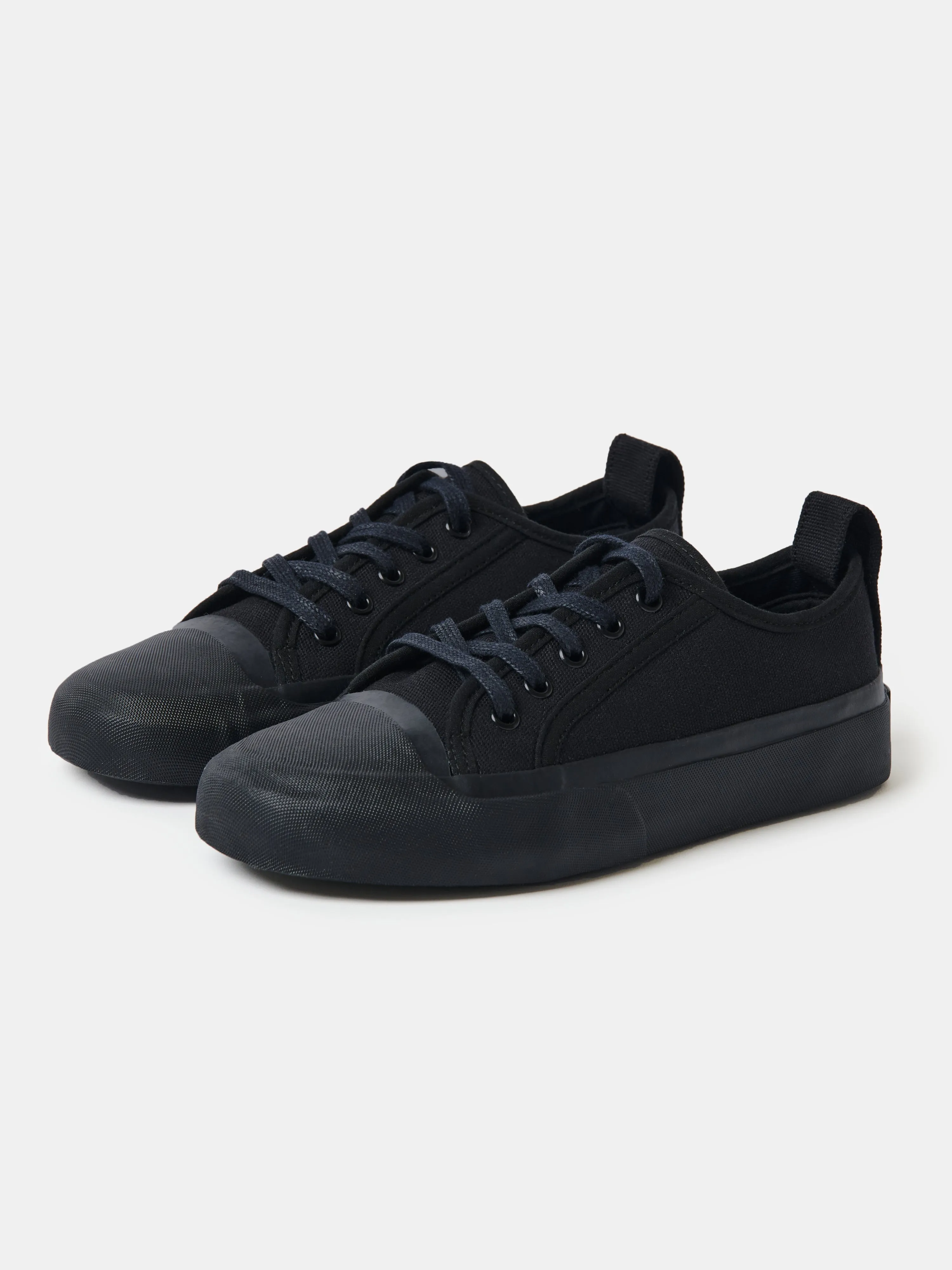 Byrd Canvas Shoe in Darkest Navy sold by Studio Nicholson
