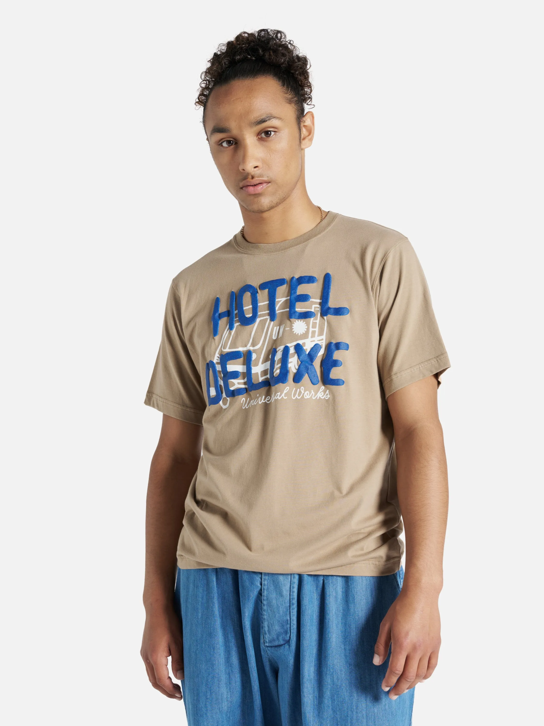 Universal Works Print Tee in Sand 'Hotel Deluxe' Single Jersey sold by Universal Works