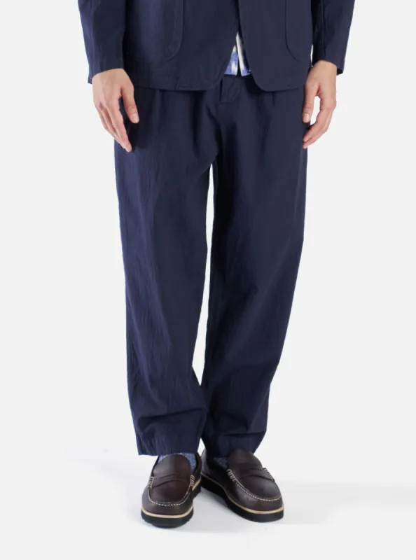 Universal Works Pleated Track Pant in Navy Seersucker II sold by Universal Works