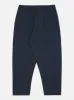 Universal Works Pleated Track Pant in Navy Twill sold by Universal Works