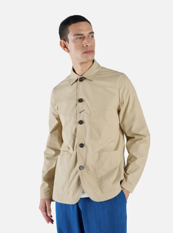 Universal Works Bakers Jacket in Sand Recycled Poly Tech sold by Universal Works