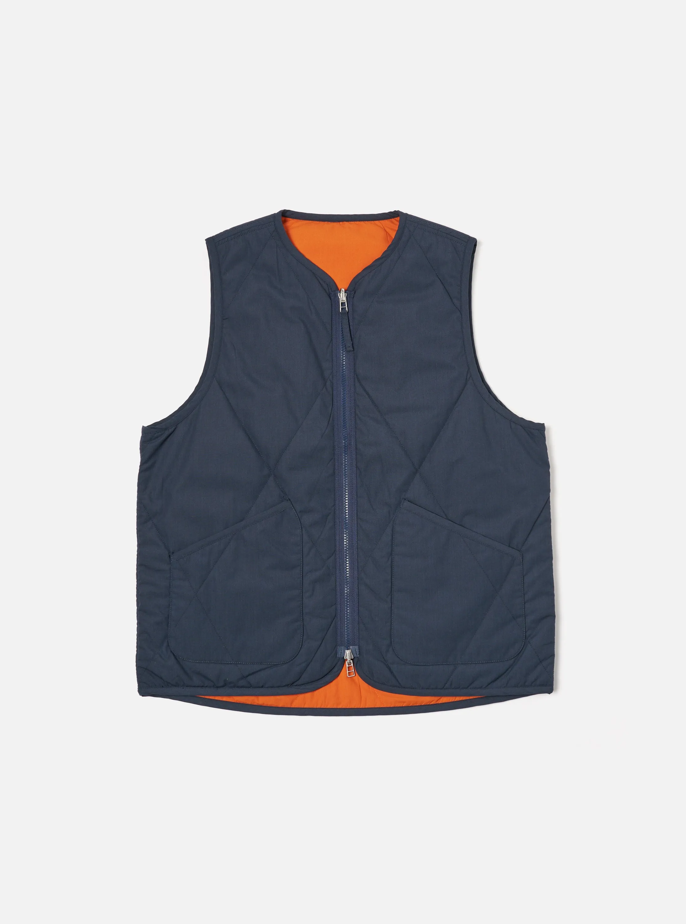Universal Works Reversible Military Liner Gilet in Navy/Orange Recycled Polytech sold by Universal Works