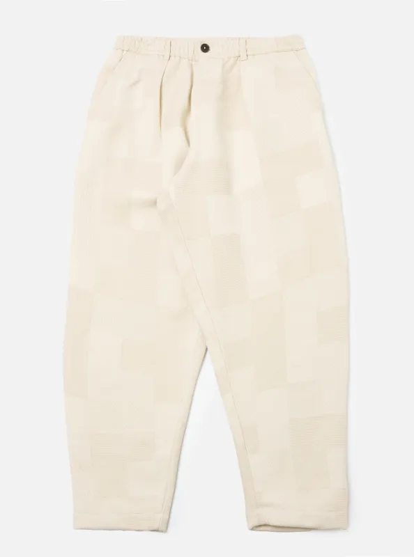 Ecru Patchwork Weave Cotton Pleated Track Pant sold by Universal Works
