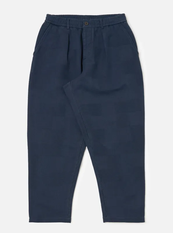 Dark Navy Patchwork Weave Cotton Pleated Track Pant sold by Universal Works