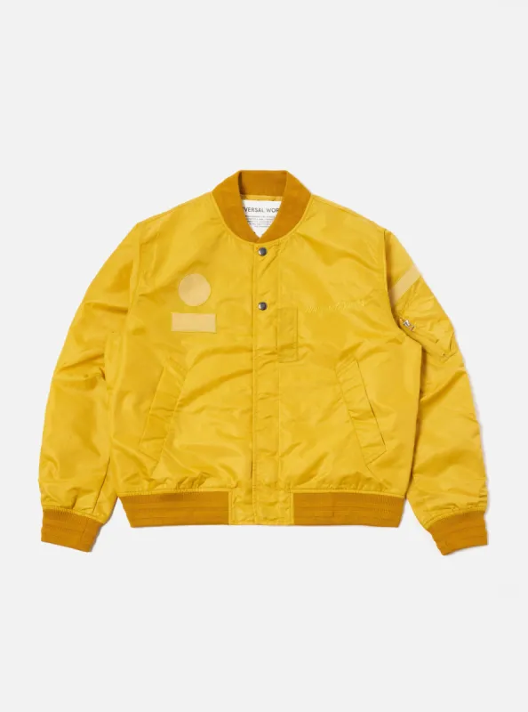Universal Works Badge Bomber in Yellow Flight Nylon sold by Universal Works