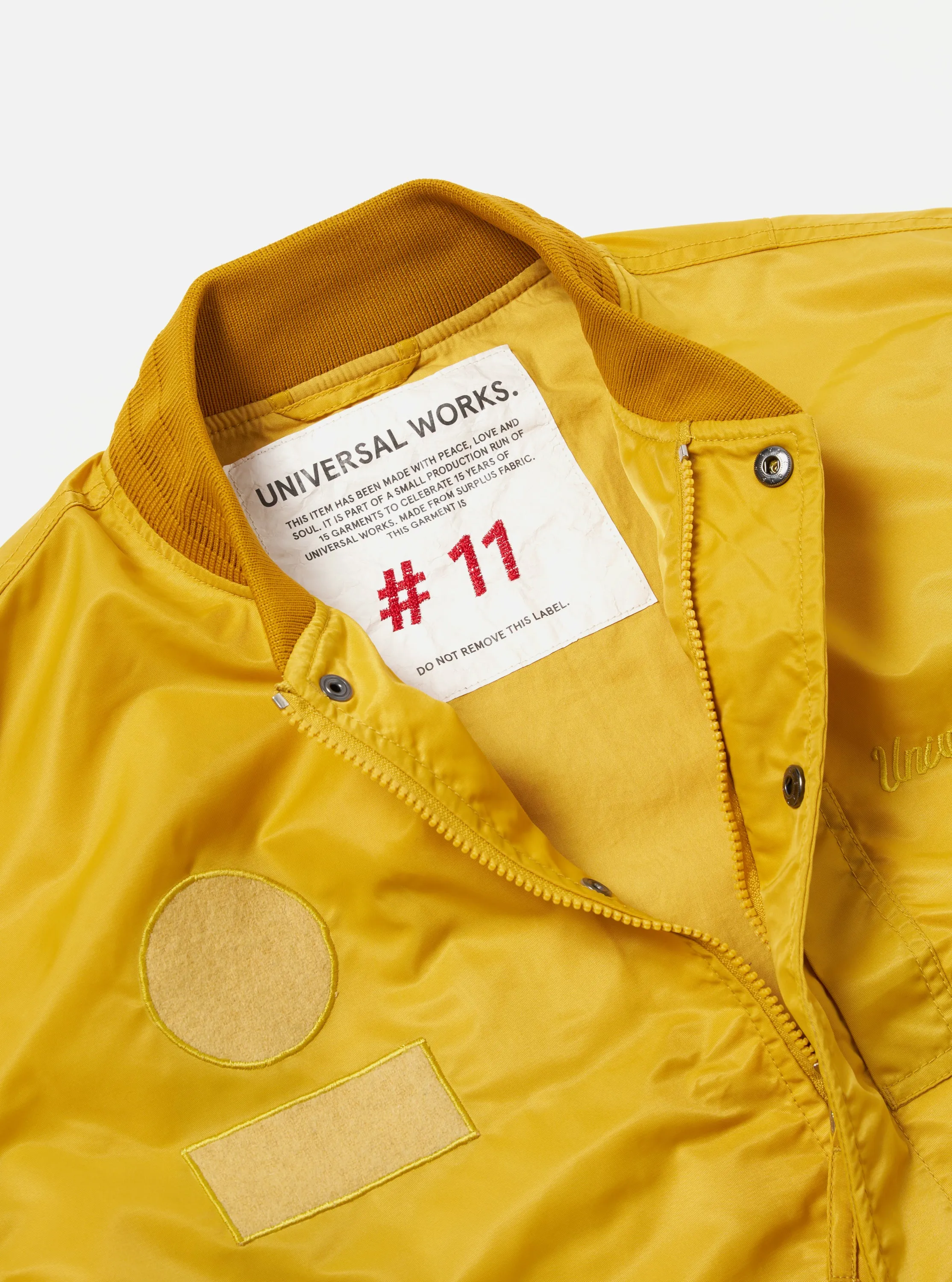 Universal Works Badge Bomber in Yellow Flight Nylon sold by Universal Works product image thumbnail 3