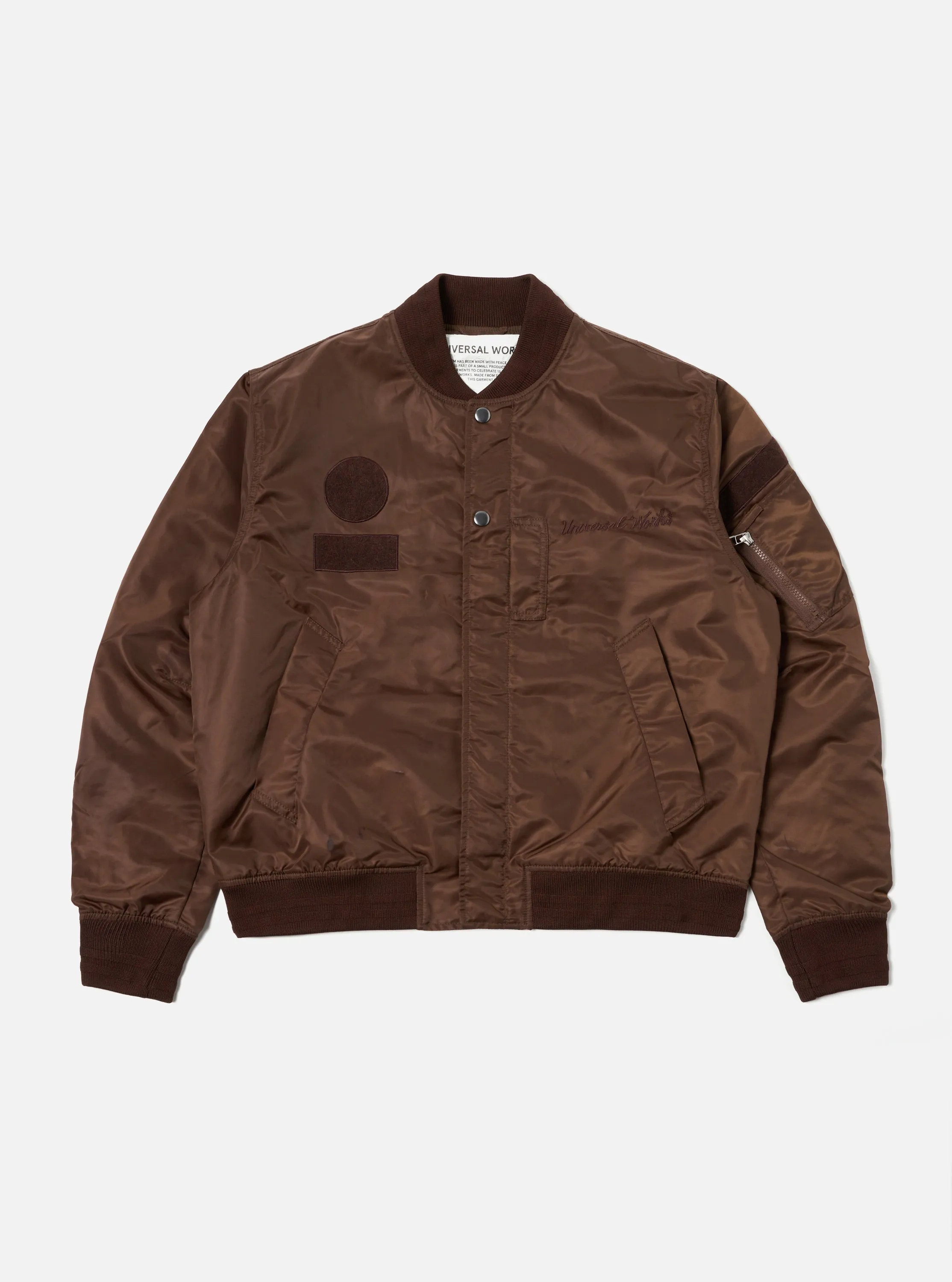 Universal Works Badge Bomber in Brown Flight Nylon sold by Universal Works