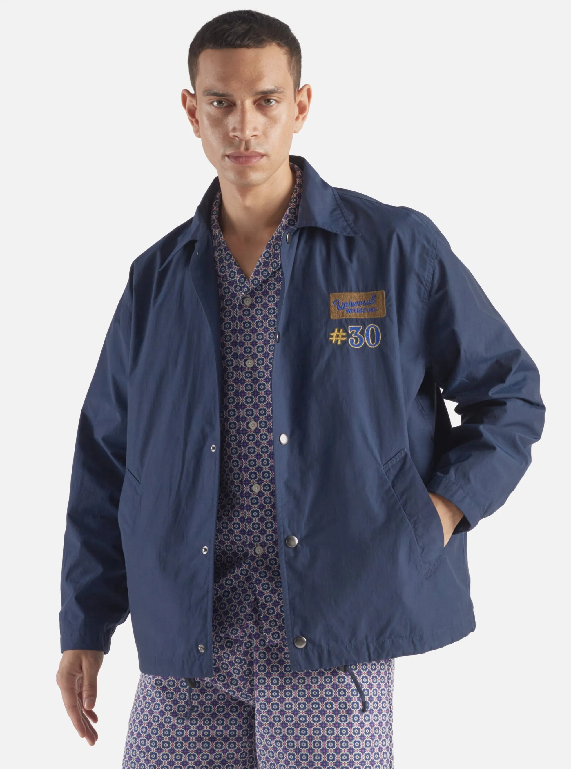 Universal Works Embroidered Head Coach Jacket in Navy Halley Ripstop sold by Universal Works