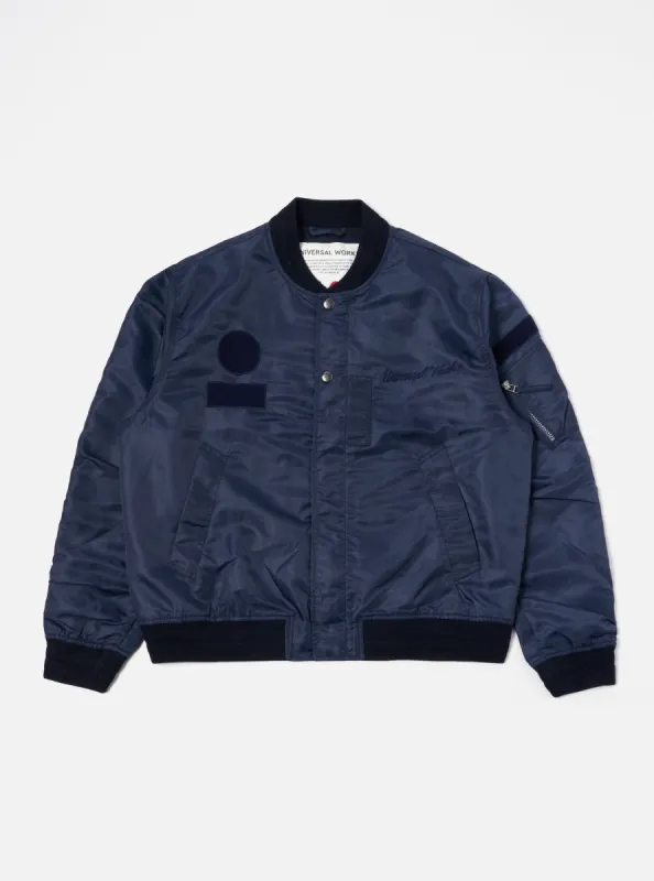 Universal Works Badge Bomber in Navy Flight Nylon sold by Universal Works