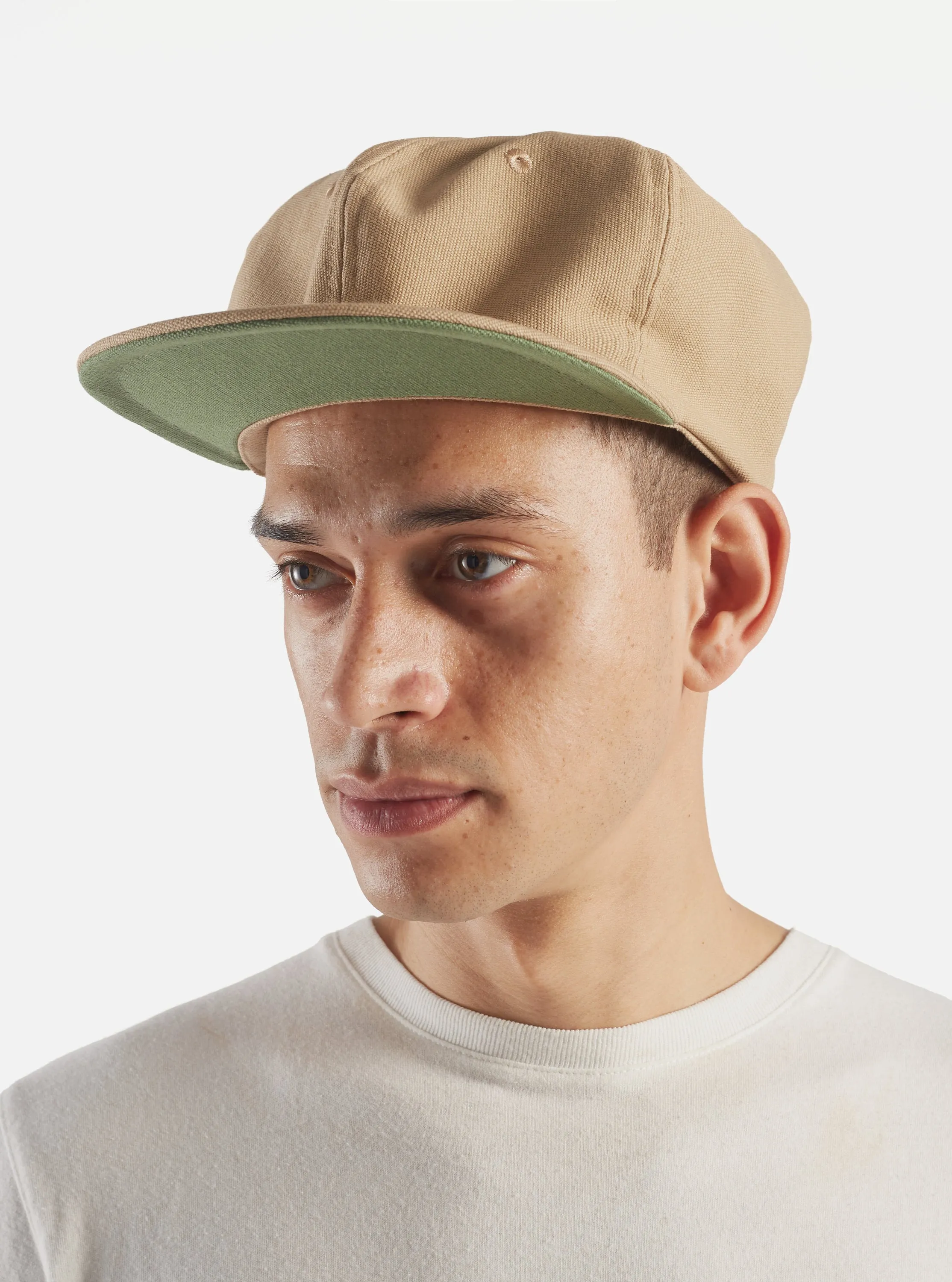 Universal Works Cricket Cap in Summer Oak Canvas sold by Universal Works