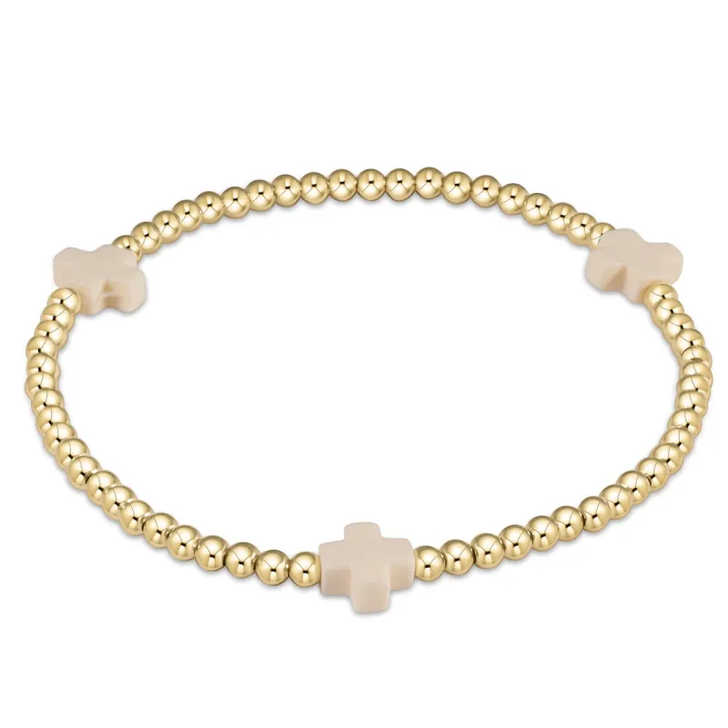 egirl signature cross bracelet gold sold by enewton