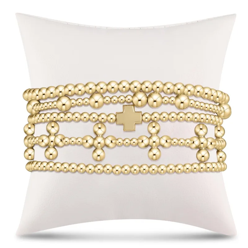 Meaningful Signature Cross Gold Stack of 5 sold by enewton