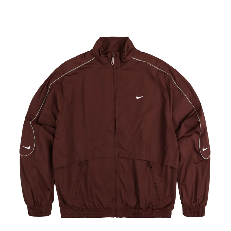 Nike	Solo Swoosh Woven Track Jacket sold by Asphalt Gold