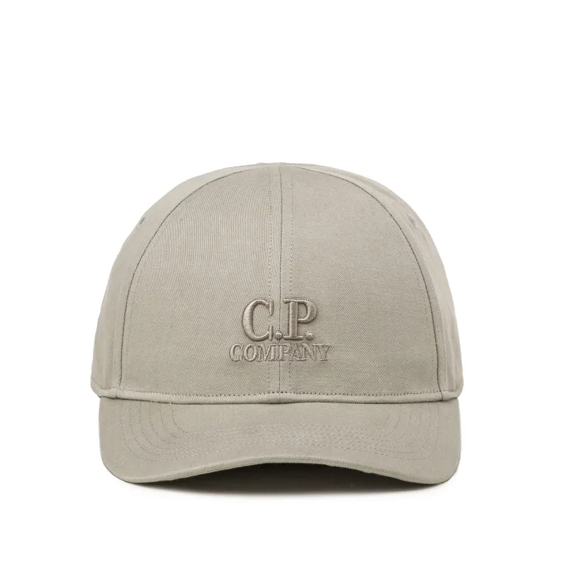 C.P. Company	Gabardine Logo Cap sold by Asphalt Gold