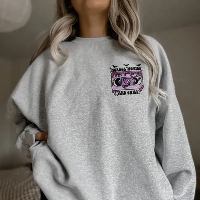 Horror Movies And Chill Embroidered Crewneck Sweatshirt (Wholesale) sold by Ally and Rae