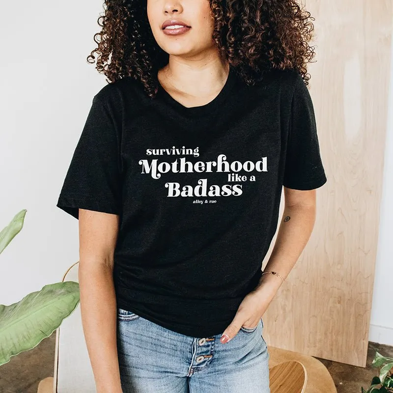 Surviving Motherhood Like A Badass Lightweight Tee sold by Alley and Rae