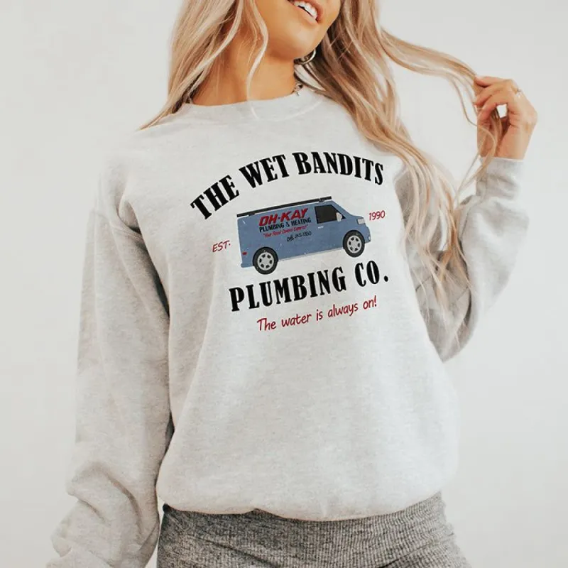 The Wet Bandits Plumbing Co Christmas Crewneck sold by Ally and Rae