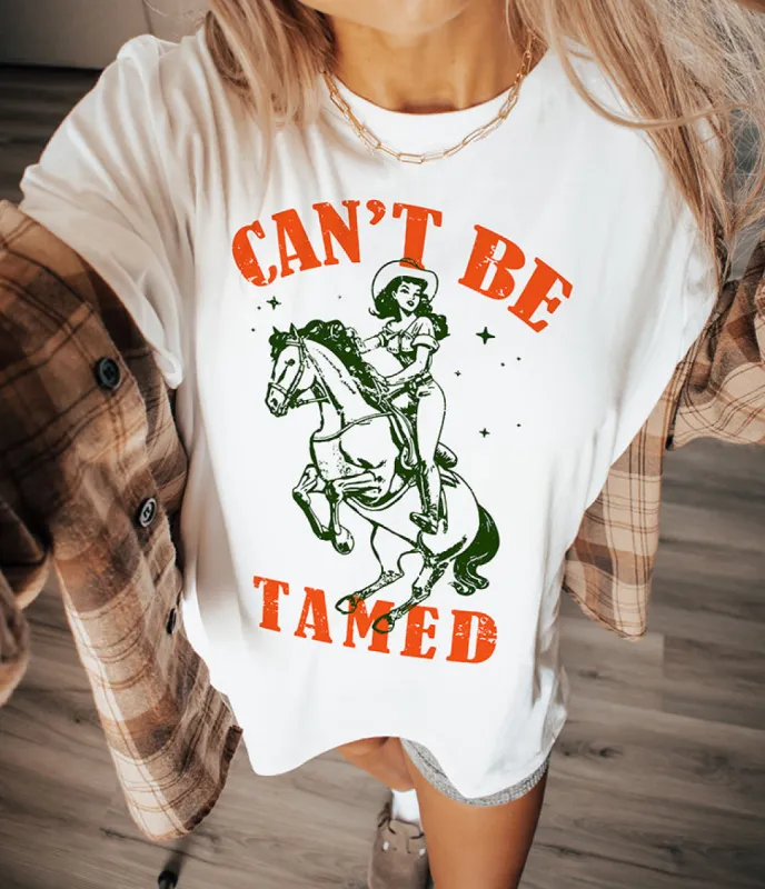 Can't Be Tamed Western Cowgirl Graphic Tee sold by Alley and Rae
