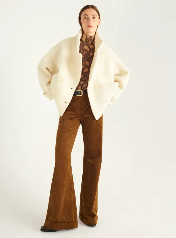 Manteau court en laine bouclée made by Cotelac