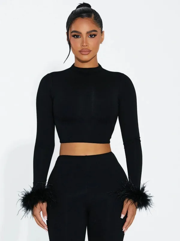 Butter Long SLeeve Micro Crop Top w/ Feather sold by Naked Wardrobe