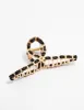 Gold Twisted Fabric Wrap Claw Clip sold by lovisa