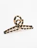 Gold Twisted Fabric Wrap Claw Clip sold by lovisa