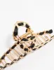 Gold Twisted Fabric Wrap Claw Clip sold by lovisa
