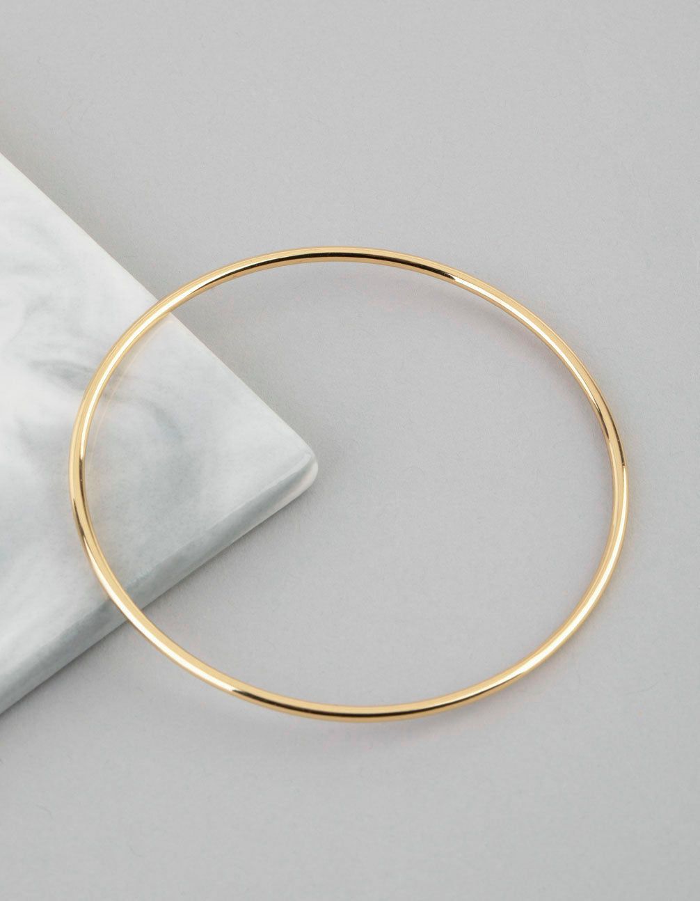 18ct Gold Plated Brass 2mm Bangle Bracelet sold by lovisa