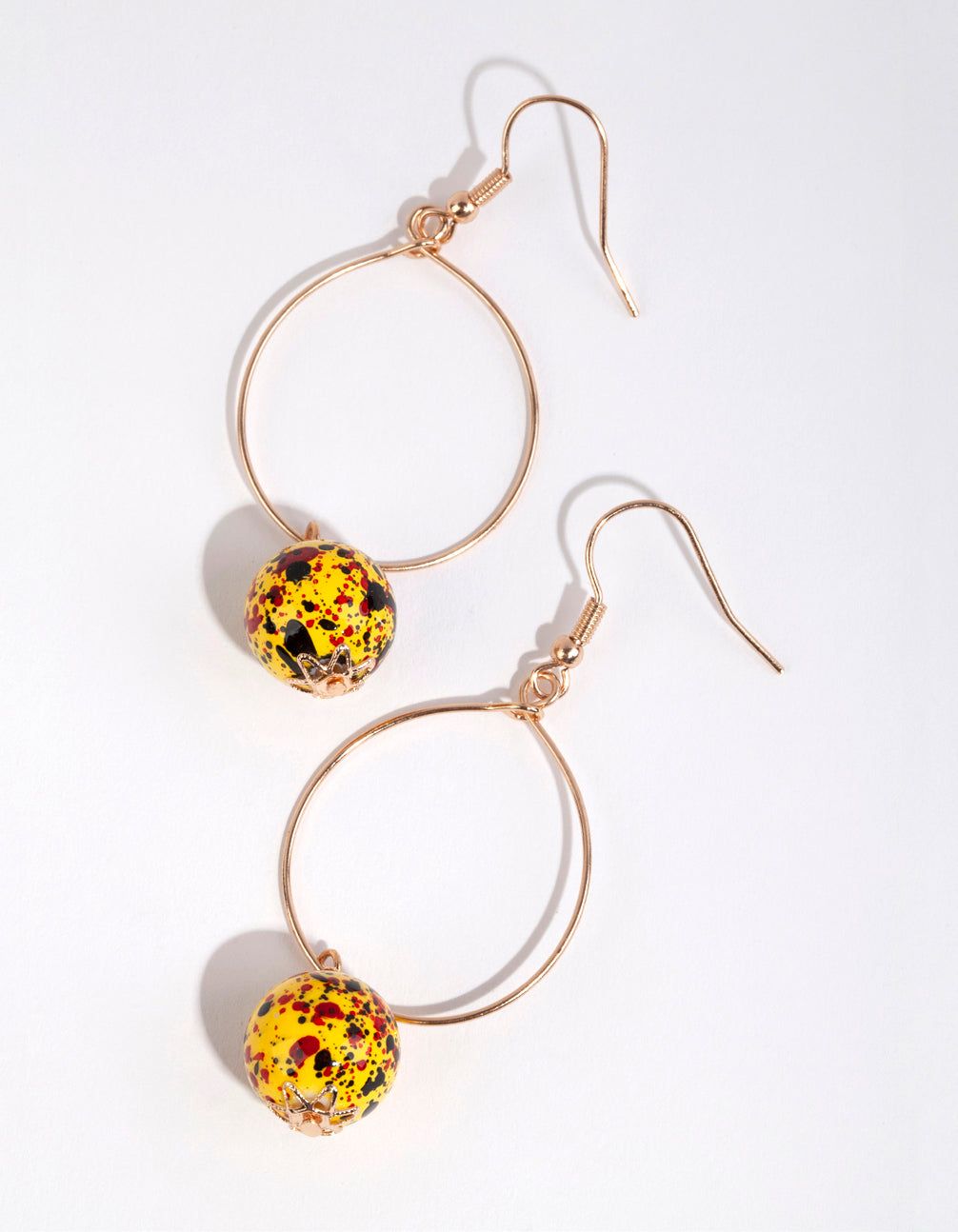Yellow Speckled Bead Drop Earrings sold by lovisa