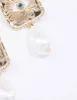 Gold Evil Eye Pearl Drop Earrings sold by lovisa