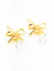 Gold Plated Sterling Silver Bow & Pear Earrings sold by lovisa
