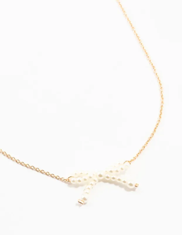 Gold Pearl Bow Necklace sold by lovisa