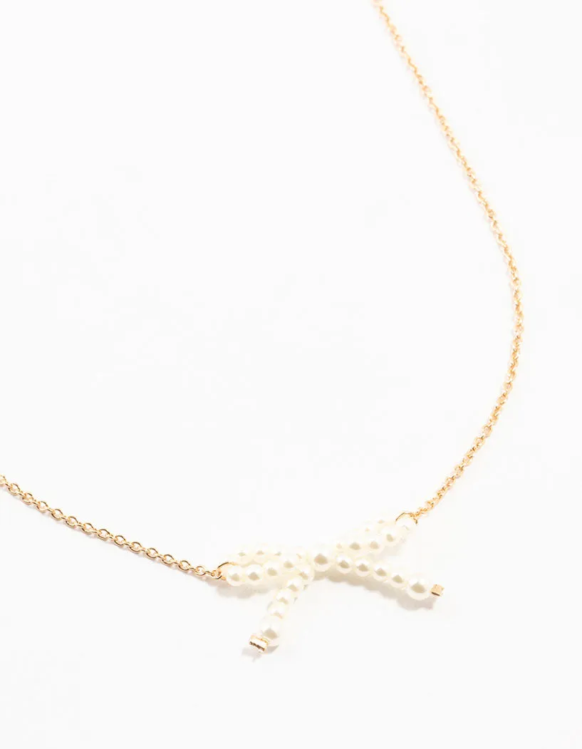 Gold Pearl Bow Necklace sold by lovisa