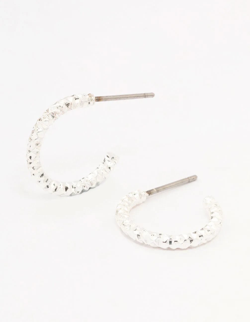 Silver Hammered Huggie Earrings sold by lovisa