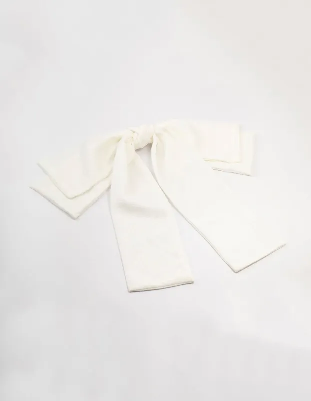 White Crepe Draped Fabric Bow Clip sold by lovisa